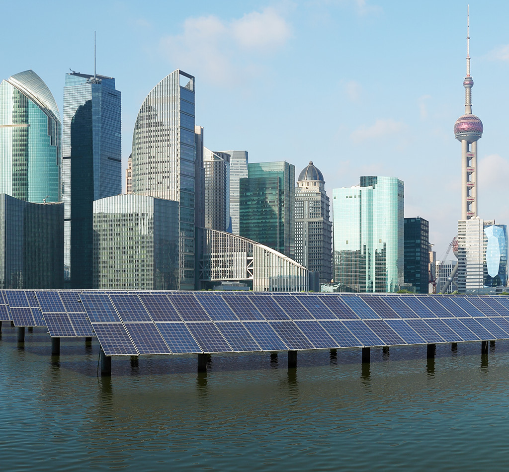 Solar power plant with Shanghai skyline.