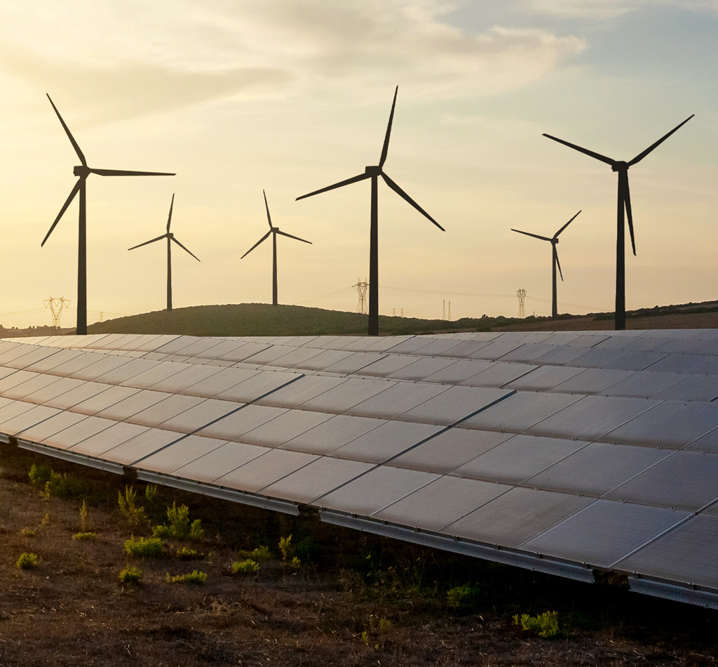 Solar panels and wind turbines generating renewable energy.