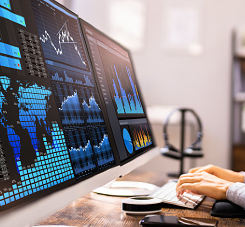 African American Business Data Analyst Woman Using Computer, global map and data on her screens