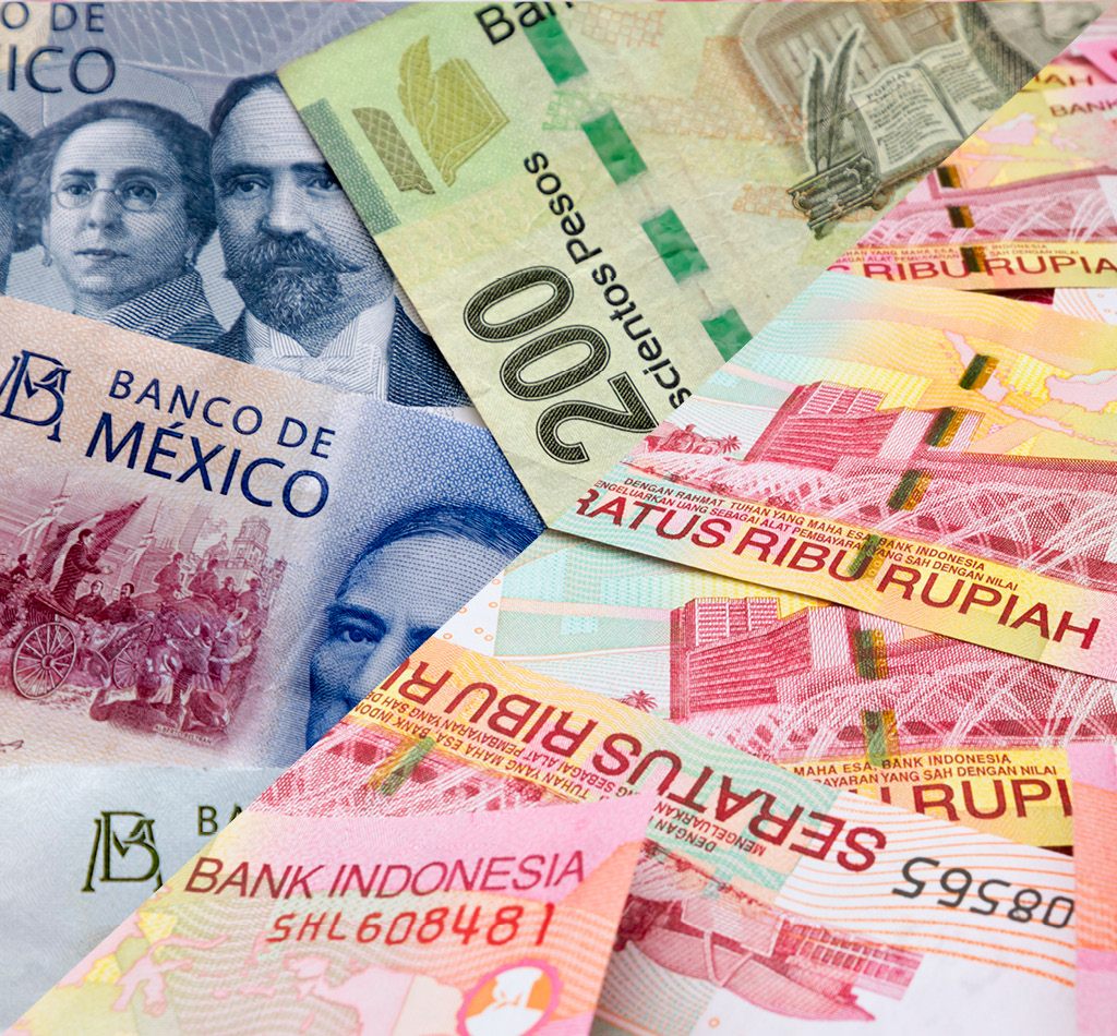 Several banknotes of Mexican & Indonesian currencies.