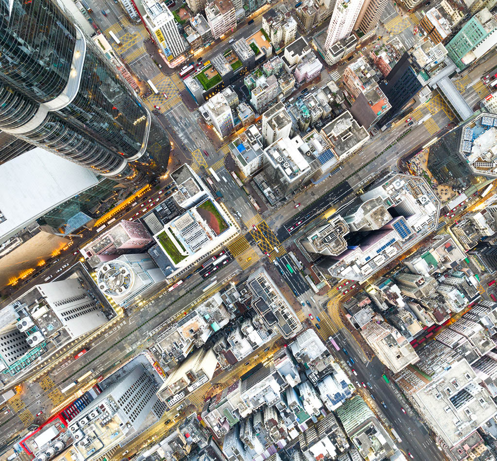 Aerial top view of skyscraper buildings and roads in Mong Kok district, downtown Hong Kong.