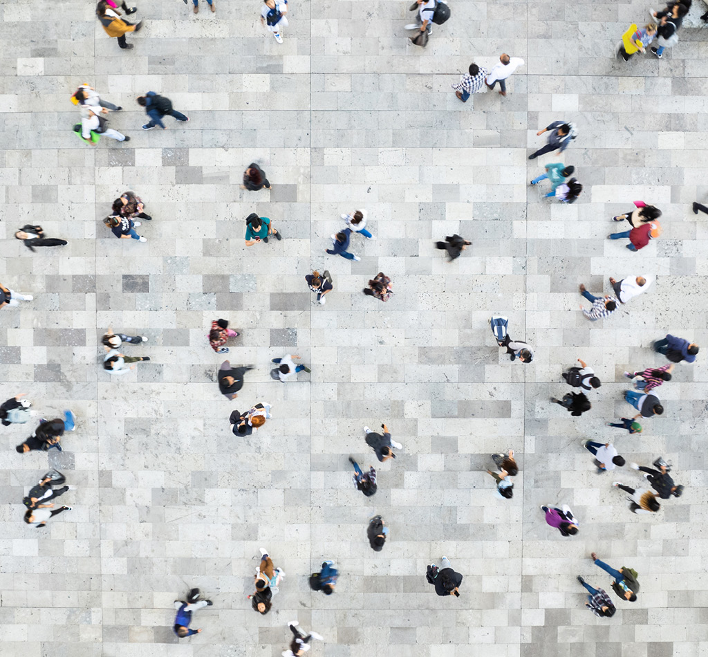 Aerial shot of a crowd of people walking in different directions.